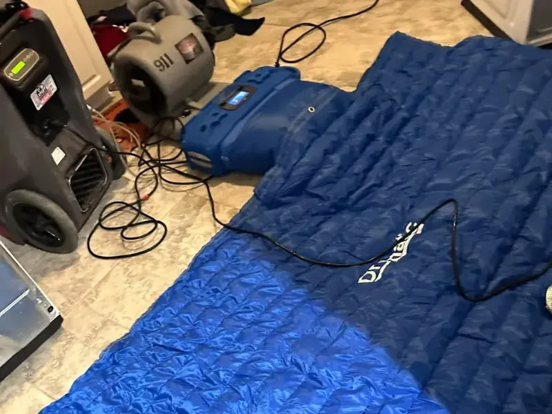 A flooded living room with buckled flooring in Olympia, WA