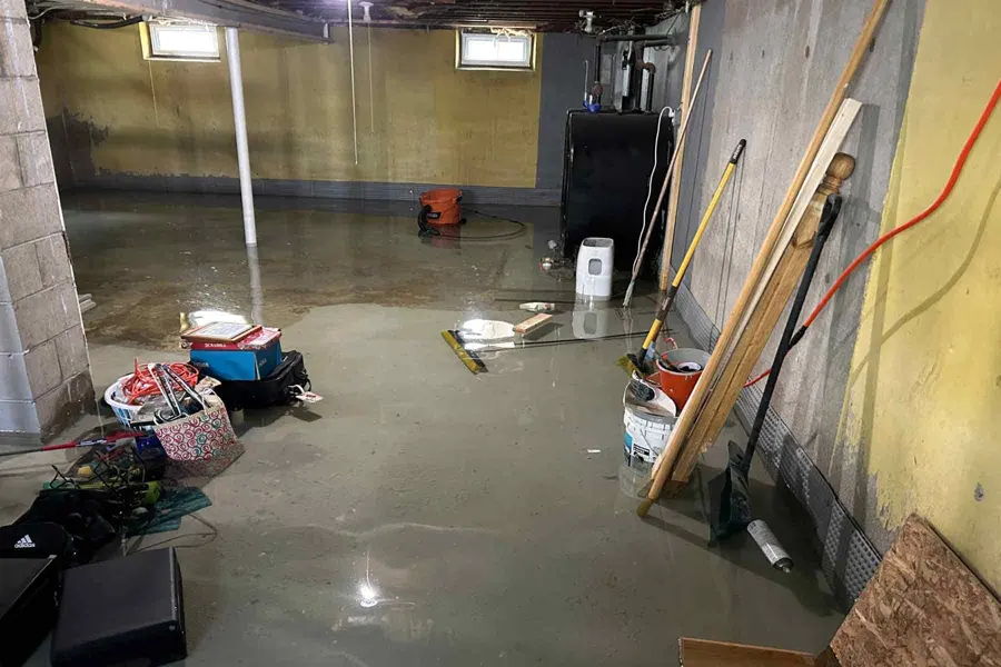 A flooded Olympia, WA basement with standing groundwater