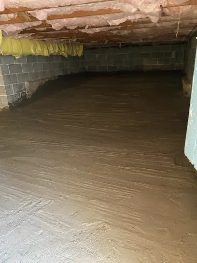 A wet Olympia, WA crawl space with joists and vapor barrier
