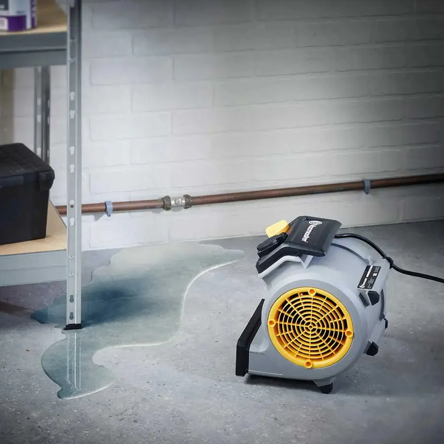 A basement being dried after a sump pump failure in Olympia, WA